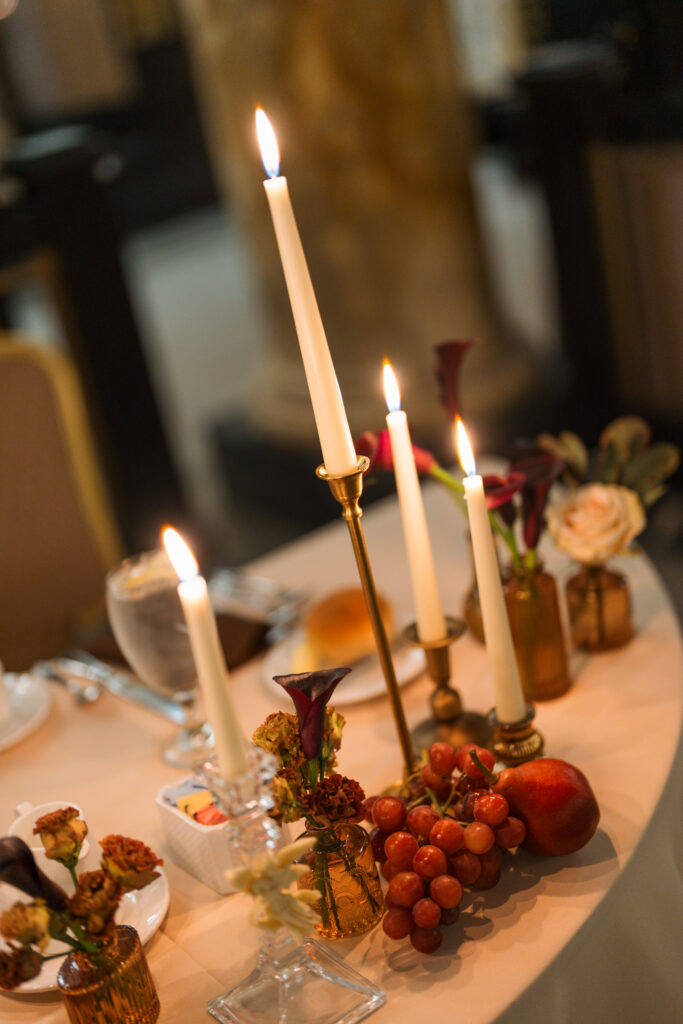 Dark academia wedding details with rich textures and antique-inspired styling